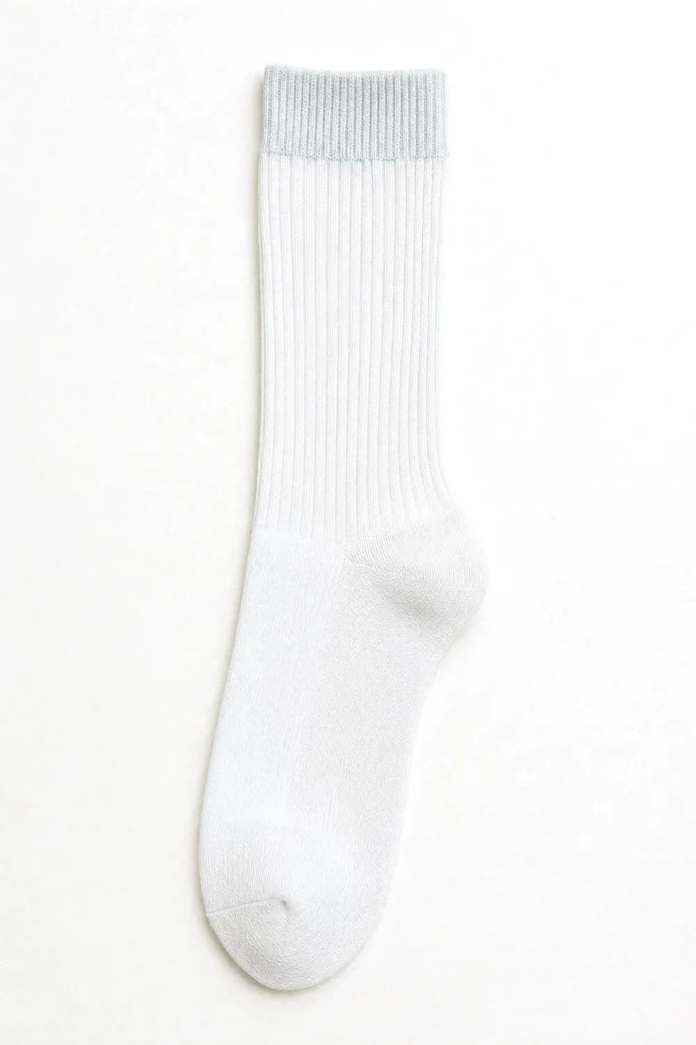 A white ribbed crew sock laid flat. Rib, heel, toe: the tone reads cool and chalky.