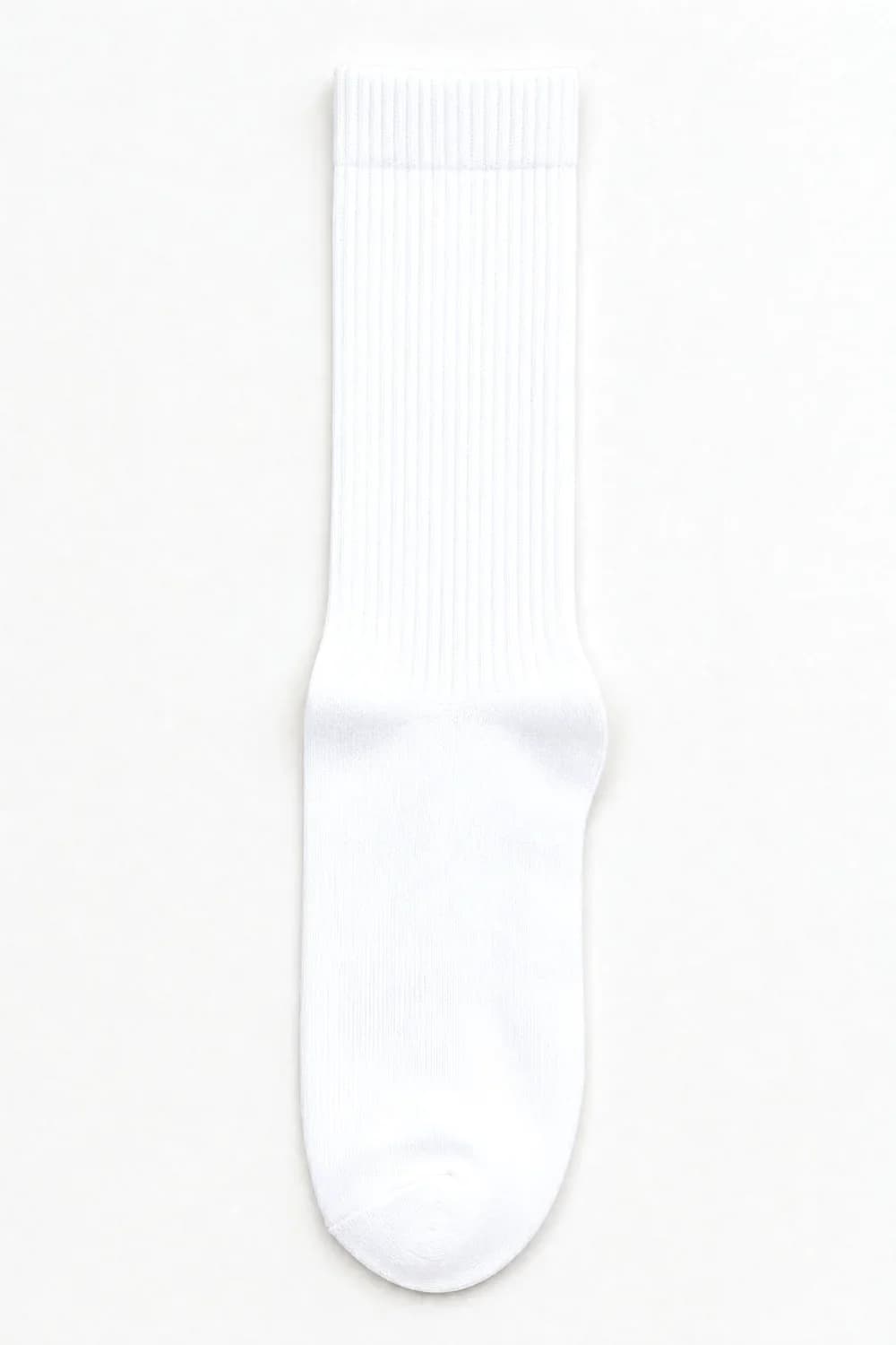 An unworn white ribbed crew sock laid flat, evenly white from cuff to toe.