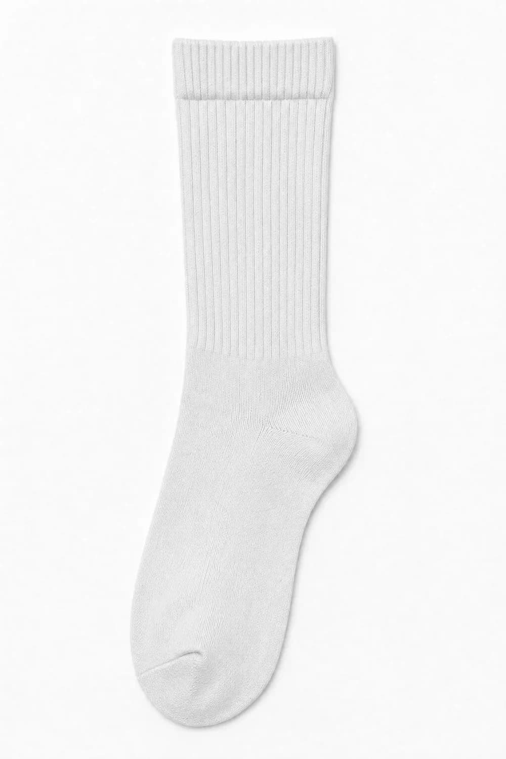 A white ribbed crew sock laid flat. Everywhere, evenly: the tone reads neutral, no hue.